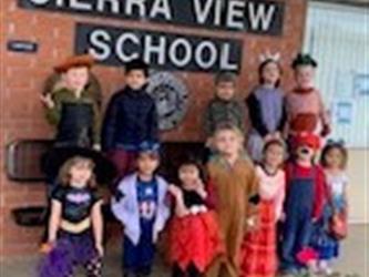 group of children in Halloween costumes